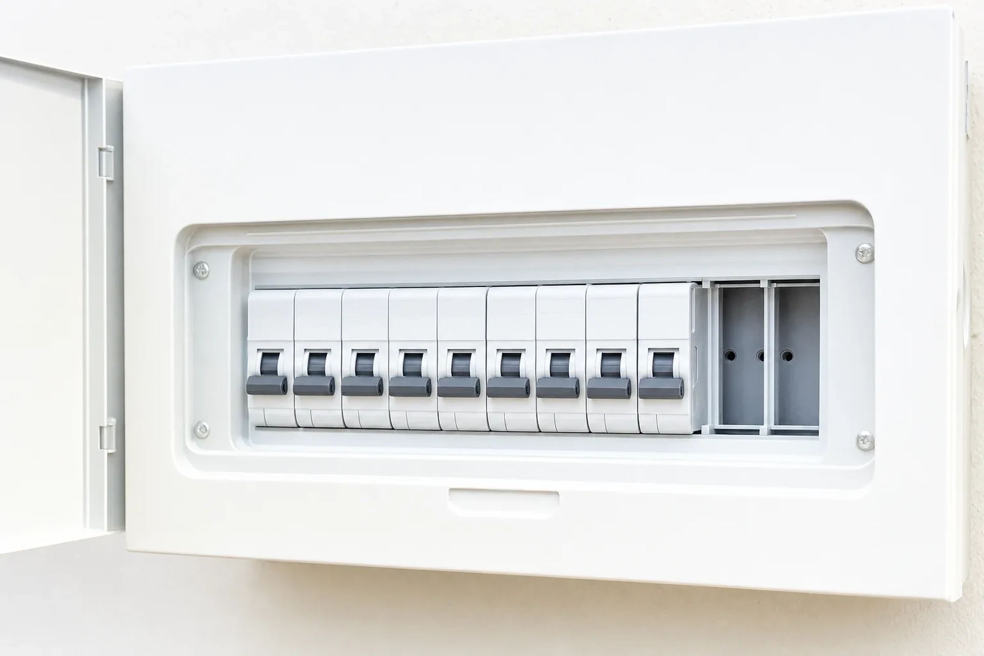 An open residential switchboard showing circuit breakers with one spare way available for a new EV charger circuit